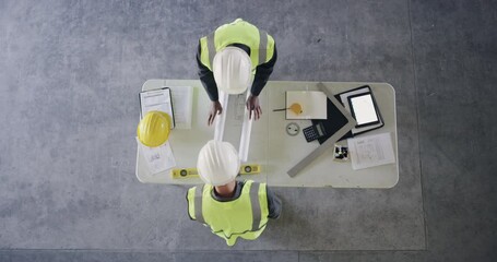 Poster - Above, tablet and engineers for meeting on table, safety gear and handshake for calculations of building materials. Construction workers, planning and technology for blueprint by technical drawings