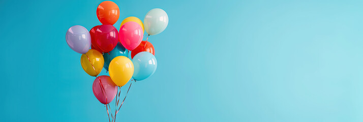 Colorful balloons isolated on solid background with copy space