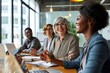 © Photo Emporium - Senior older female executive ceo and happy multicultural business people discuss corporate project at boardroom table. Smiling diverse corporate team, Generative AI