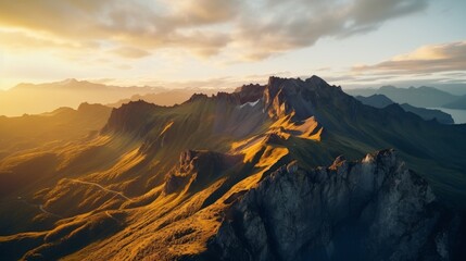  Mountain range bathed in golden light seen from above