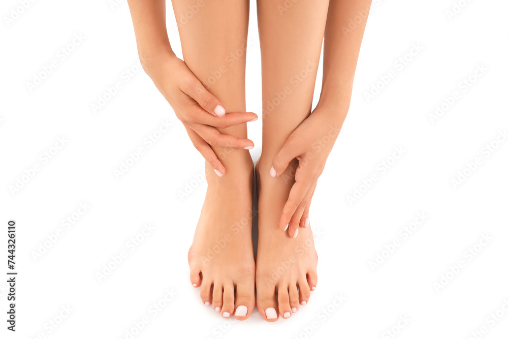 Beautiful young woman making foot massage on white background