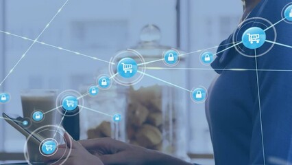 Poster - Animation of network of connections with trolley icons over caucasian woman with tablet in cafe