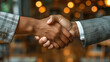 © easybanana - Close Up of Two People Shaking Hands