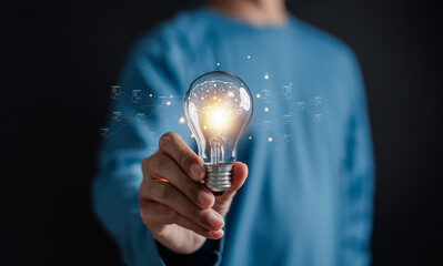 Aufkleber - Businessman holding Light bulb for mind, creative, idea, innovation, motivation planning development leadership and customer target group concept.