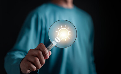 Aufkleber - Businessman holding Light bulb icon which for mind, creative, idea, innovation, motivation planning development leadership and customer target group concept.