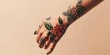 Fototapeta  - The trend of tattoos on a girl s hand reflects the spirit of freedom, rebellion and uniqueness. Banner of a delicate tattoo on a beige background