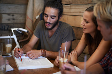 Canvas Print - Studying, book and students in college at cafe with friends and talking about notes on project. University, education and people learning ideas together at coffee shop in conversation of course work