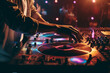 american dj working with sound, spinning turntable records at a night club party