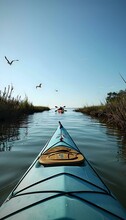 A View From The Front Of A Kayak On A River