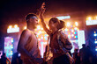 © Drazen - Young happy couple dancing on summer music festival at night.