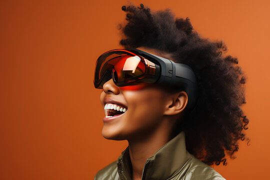 Beautiful african american woman wearing virtual reality goggles on orange background