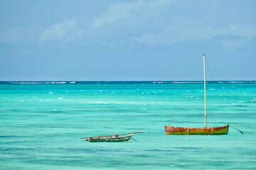 Wall Mural - Scenic view of moored boats at Jambiani beach, Zanzibar