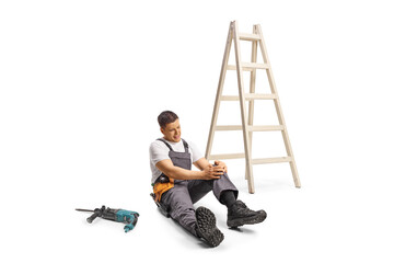 Sticker - Repairman with knee injury sitting on the ground next to a ladder