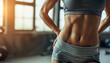 close up of a female athletes midsection during a workout her defined abs highlighted by natural lighting designed with copy space at the top for fitness program details or inspirational messages