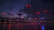 A fleet of drones lighting up the night sky creating a mesmerizing light show.