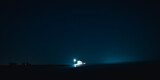 Fototapeta  - A house at night over clear sky