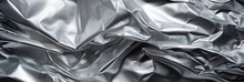 Aluminum Foil Texture Background. Silver Crumpled Sheet Of Paper.