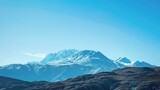 Fototapeta Natura - Snow Covered Mountains Skyline In Winter On Clear Blue Sky