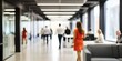 © MadeByAnas - business people walking in bright office lobby fast moving with blurry, crowded office workplace people walking in corridor, busy business people executives walking in office building interior lobby