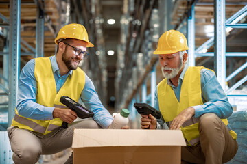 Wall Mural - Warehouse workers scanning box