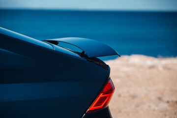 Canvas Print - Active aerodynamic system spoiler on the trunk of modern car