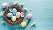easter holiday celebration banner greeting card with pastel painted eggs in bird nest on bright blue backround tabel texture top view flat lay with copy space