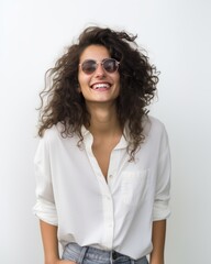 Wall Mural - Smiling Arabic Hipster Woman in Sunglasses Backlit Portrait