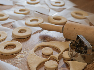 Homemade donut dough and tools for making it. Wooden roller.