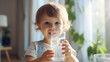 © Anna Iluschenko - close-up portrait of a small child drinking clean water from a glass. Healthy lifestyle concept