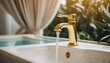 elegant sanitary ware golden water tap in a luxury bathroom in pastel colors clean transparent water flows