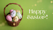 Happy Easter! - Easter basket with eggs on a green background, inscription Happy Easter!