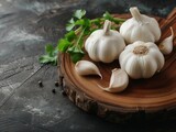 Fototapeta Miasto - garlic on a wooden board with copy space