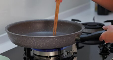 Canvas Print - Cooking the tomato in the grill pan at kitchen