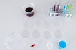 © Wavebreak Media - Laboratory setup with petri dishes and test tubes on a white surface