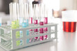 © Wavebreak Media - Test tubes with colorful liquids in a lab rack, focus on the foreground