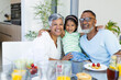 © Wavebreak Media - Biracial grandparents enjoy breakfast at home