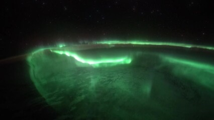 Wall Mural - aurora northern lights over planet earth seen from space. view from international space station. pub