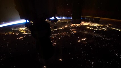 Wall Mural - planet earth at night seen from space in real time. glowing cities illumination of earth. view from 
