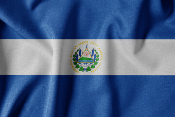 National Flag on Textured Fabric Background. Silk textured flag, realistic wave and flag look. SV  Flag of El Salvador