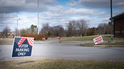 Red, White, and Blue Voter parking only sign at polling election station.