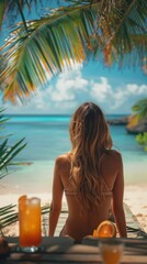 Canvas Print - A woman in a bikini sitting at a table on the beach