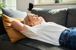 © baranq - Peaceful mature woman taking nap during on sofa