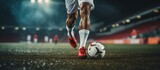 Fototapeta Sport - Photo shot of legs Soccer player running dribbling after the ball in stadium soccer