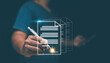 © krungchingpixs - Electronic signature, E-signing, Businessman use a pen to signing e document on virtual screen. Paperless office concept, Digital document management technology. Online signing with application.