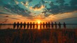 © akarawit - Silhouettes of a group of graduation students standing by the open lake at sunset