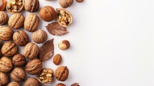 Fresh Assorted Nuts And Leaves On White Background For Healthy Eating Concept