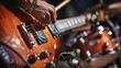 © Aris Suwanmalee - A close up of a musician playing a guitar