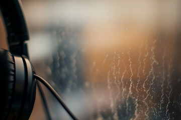 Microphone and headphones on the stage with foggy background. 