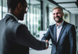 © oneli - Photo of young successful business people hand shaking after meeting