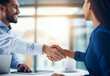 Photo of young successful business people hand shaking after meeting